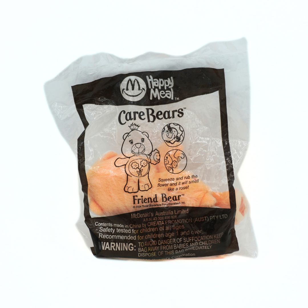 Happy Meal toy packaging featuring Care Bears on a white background