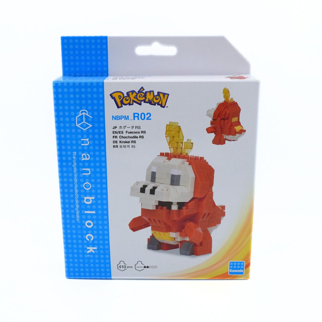 A blue and white Nanoblock box with a nanoblock rendering of Fuecoco, a red Pokemon