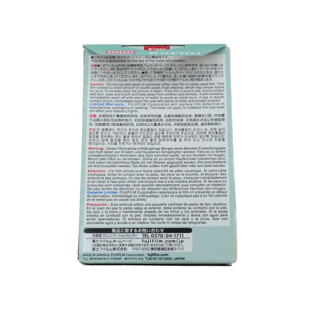 The back of a Japanese Fujifilm, showing detailed text in multiple languages, warning labels, and contact information on a white background.