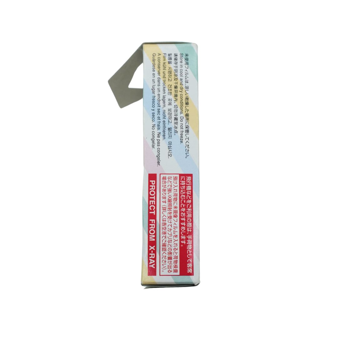 The side of a rectangular product box shown against a plain white background, featuring Japanese text, a red warning label, and a small gray flap or tab protruding from the top.