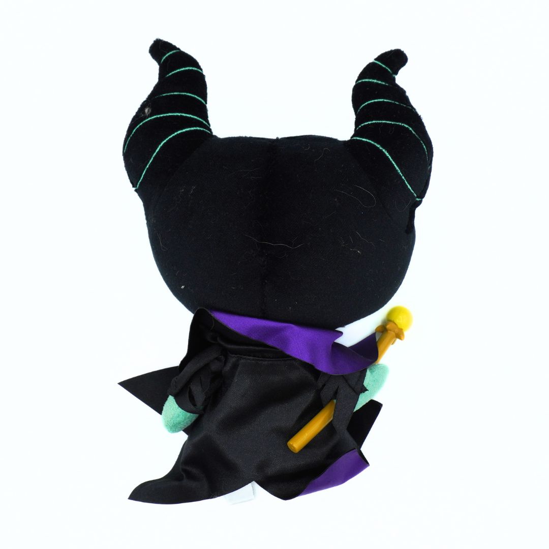 A black plush toy styled like Maleficent, shown from the back. It features curved horns with light green stitched details, a purple collar, and holds a yellow staff with mint green accents.