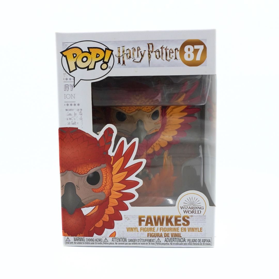 Funko Pop! Harry Potter Fawkes vinyl figure number 87 in its original window box packaging, featuring a red and orange phoenix design.