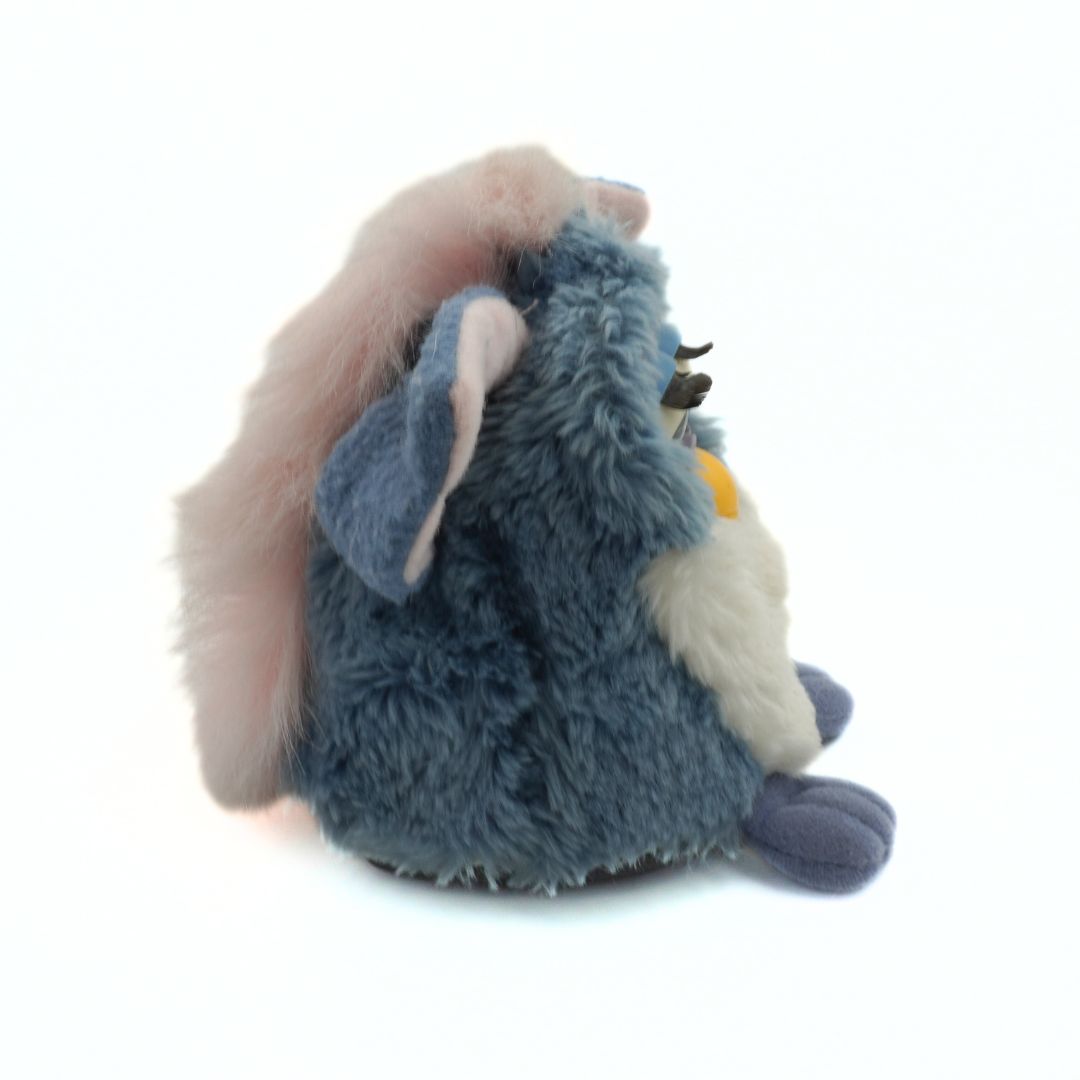 Plush toy resembling a character with a long pink nose on a white background