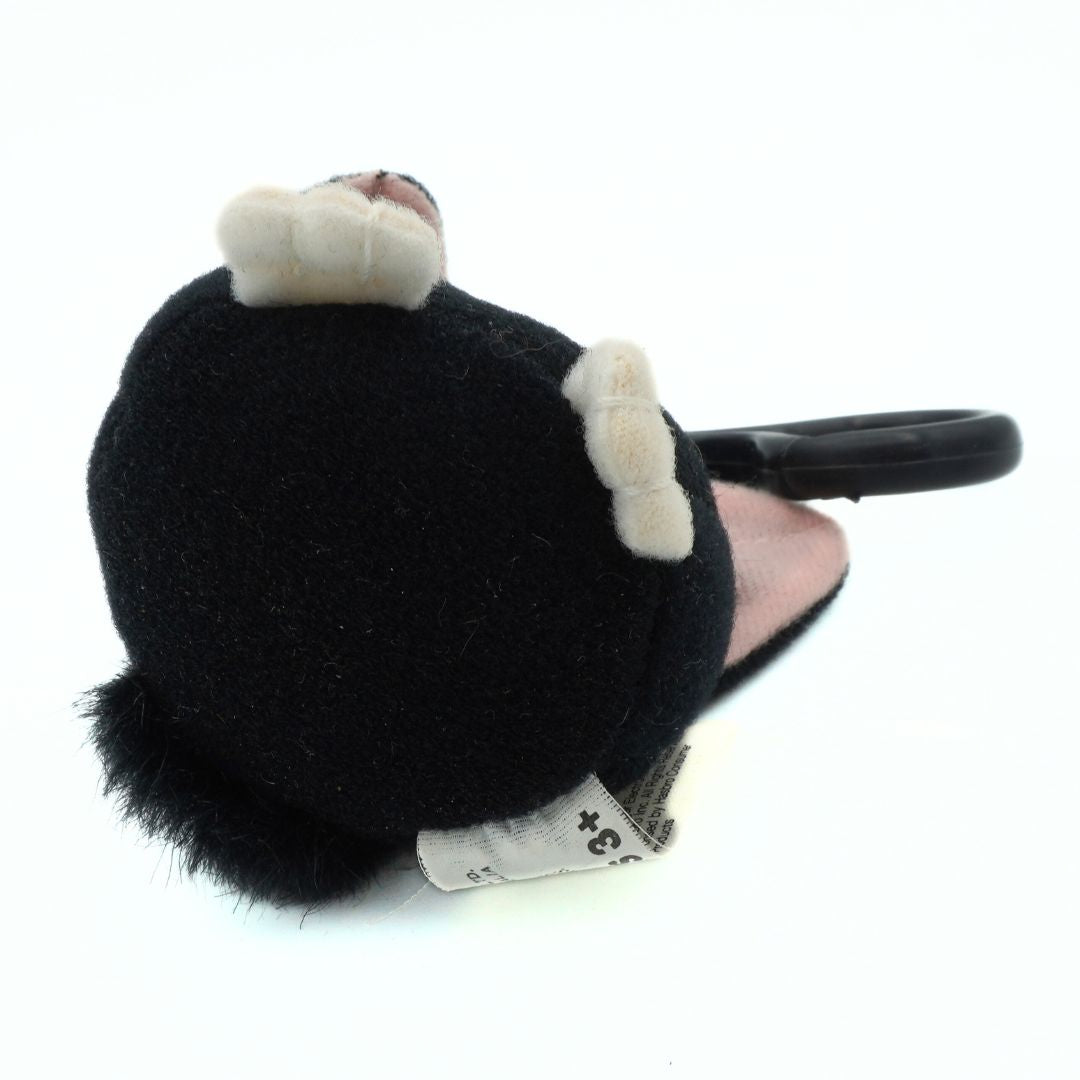 Black and white plush monkey keychain on a white background
