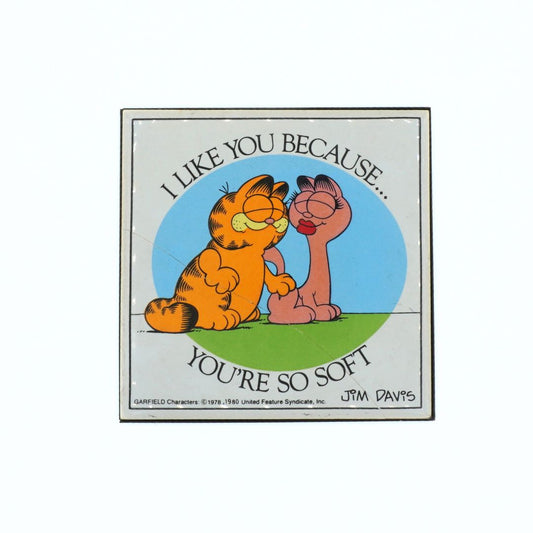 1980 colourful tile featuring Garfield and a girl cat, with Jim Davis's name in the corner