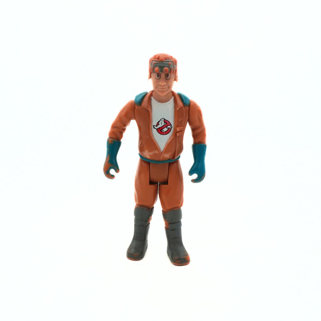 Action figure in an orange suit with a white shirt featuring a ghost logo on a white background