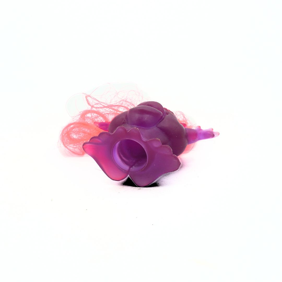 Purple and pink butterfly-shaped object on a white background