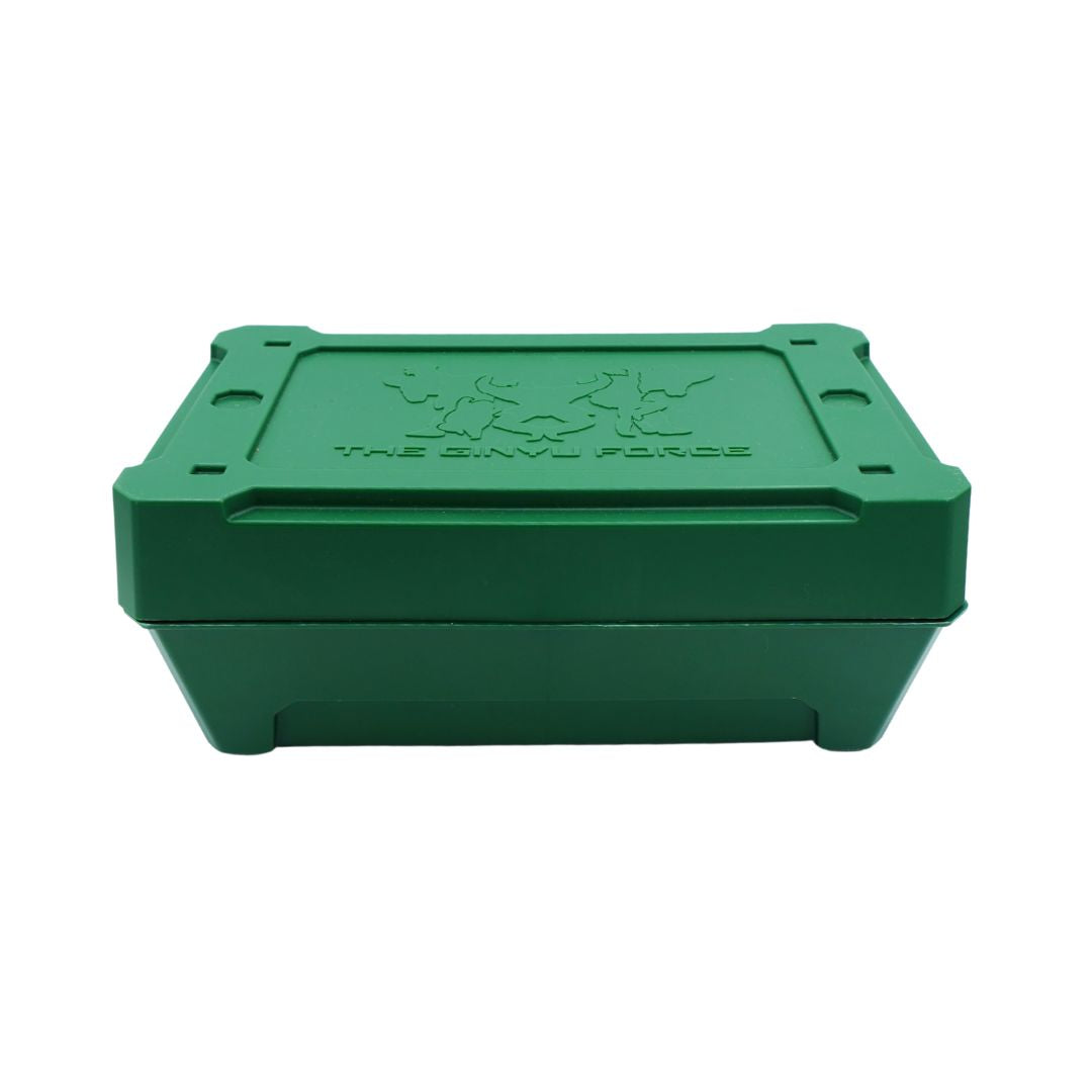 A green rectangular hard case with a hinged lid, featuring an embossed logo and the text 'THE GINYU FORCE' on the lid, shown against a plain white background.