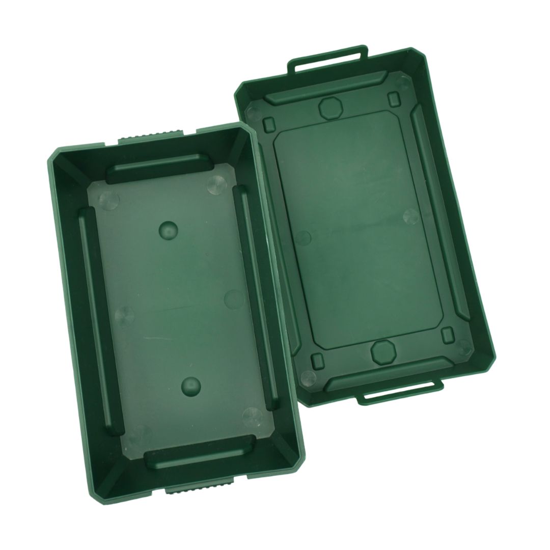A dark green plastic storage box shown open, displaying both the interior base and the exterior lid with integrated handles, set against a plain white background.