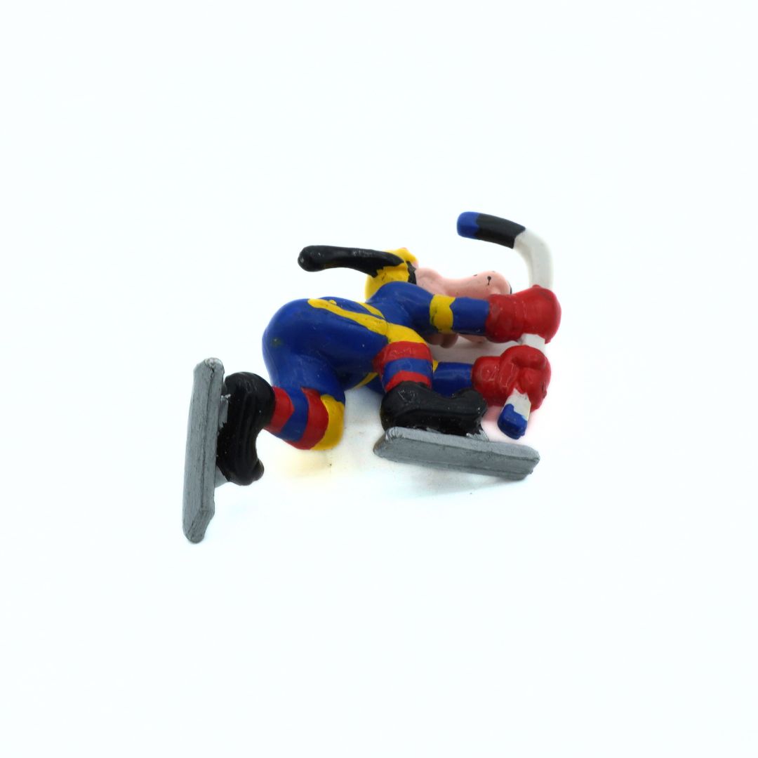 Toy figure of a skater in action on a white background