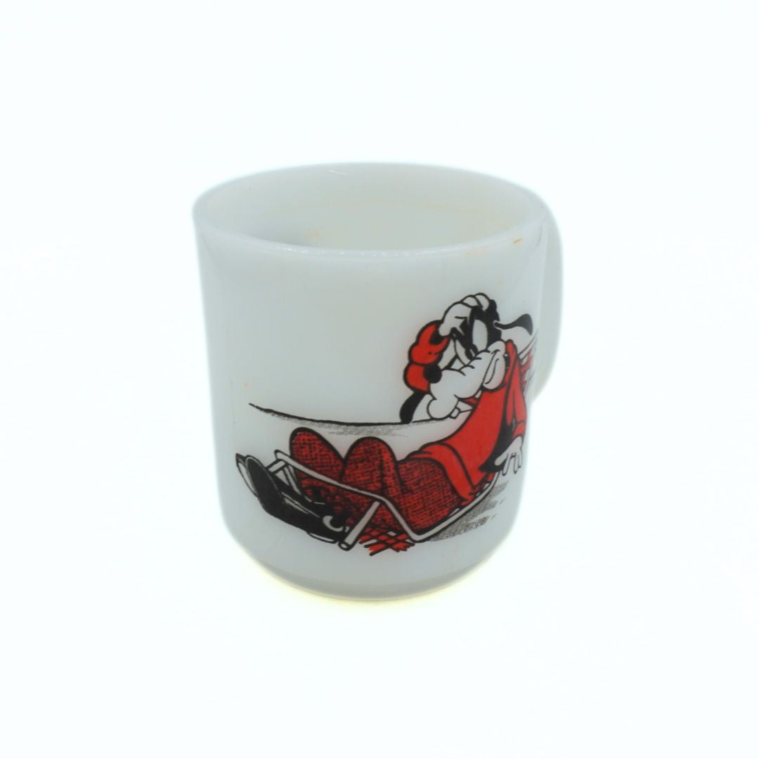White ceramic mug with a cartoon character design on a white background