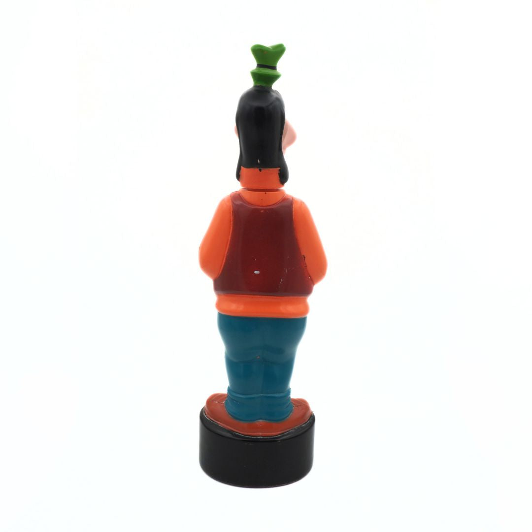 Cartoon character figurine with a green hat on a white background