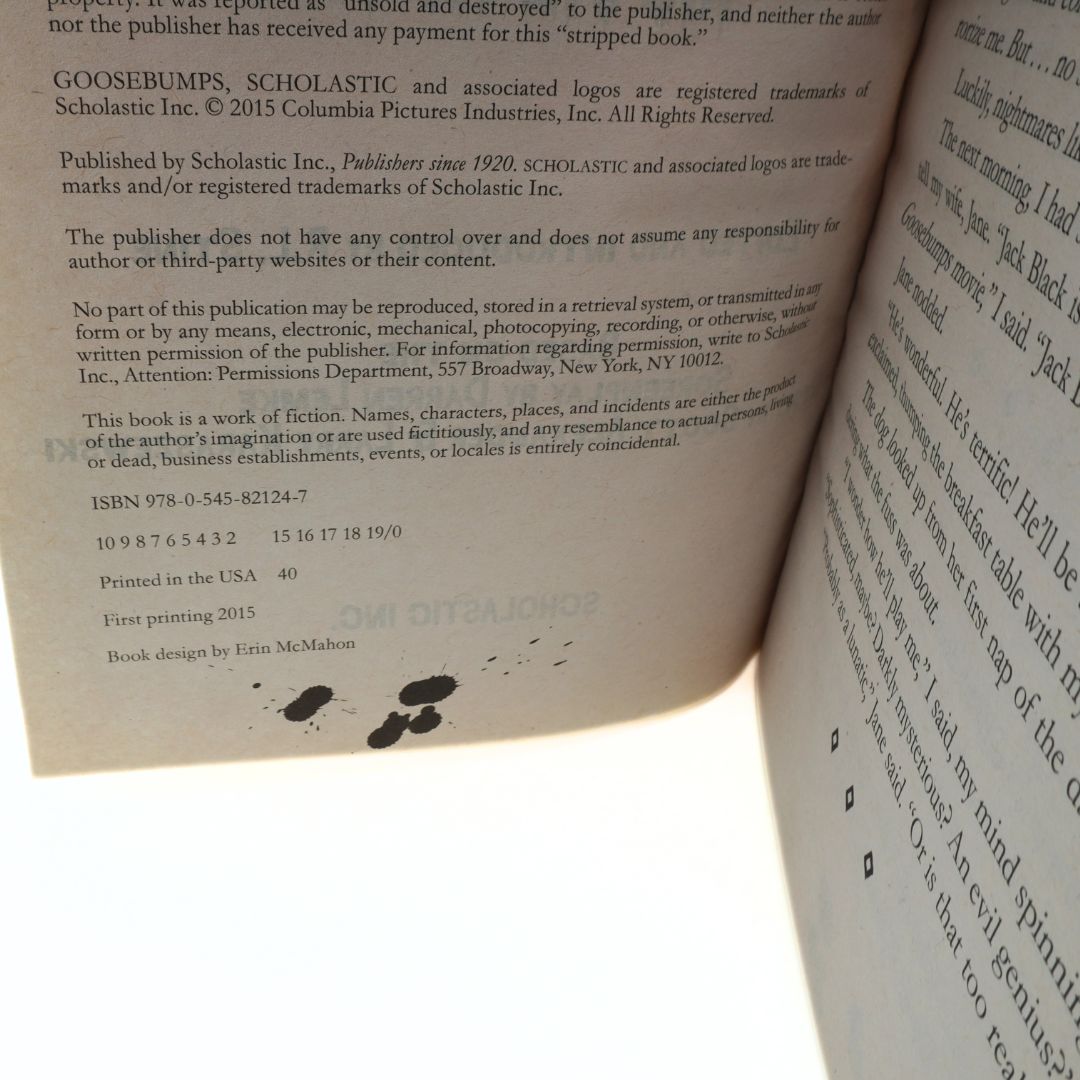 Open book with copyright information and text on a white background