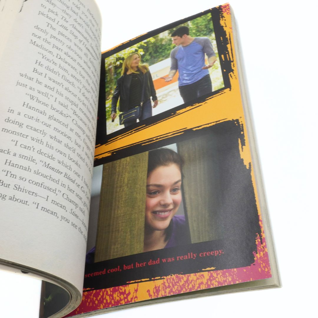 Open book with photos of a couple and a young girl on the pages.