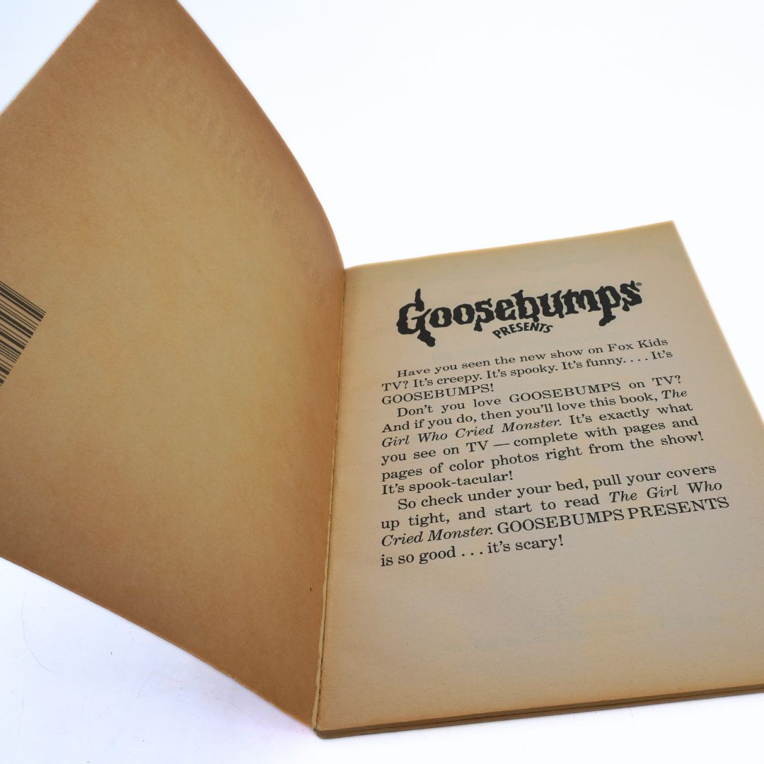 Open book with 'Goosebumps' text on a white background