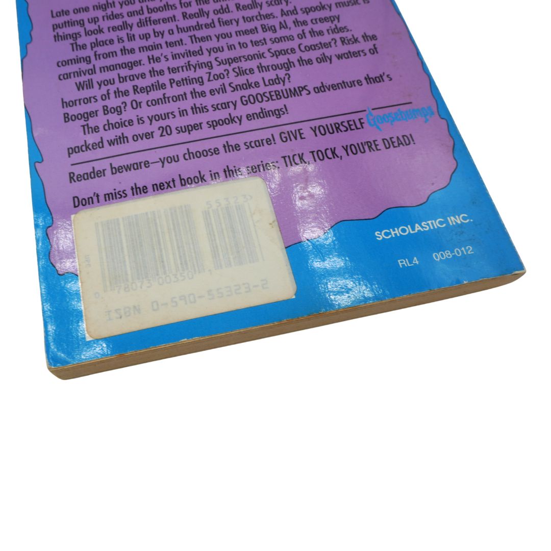 Back cover of a Scholastic book with text and a bar code on a white background