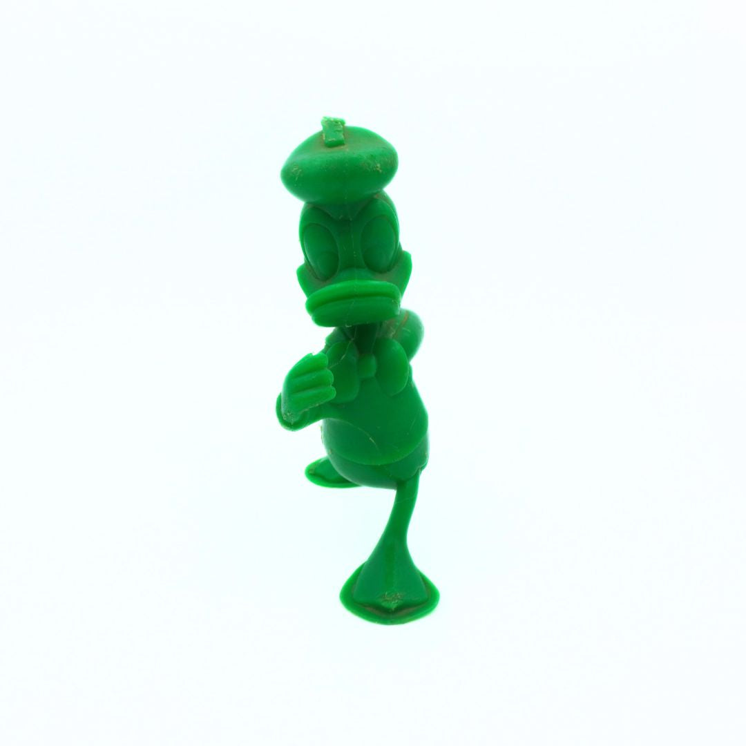 Green plastic toy on a white background