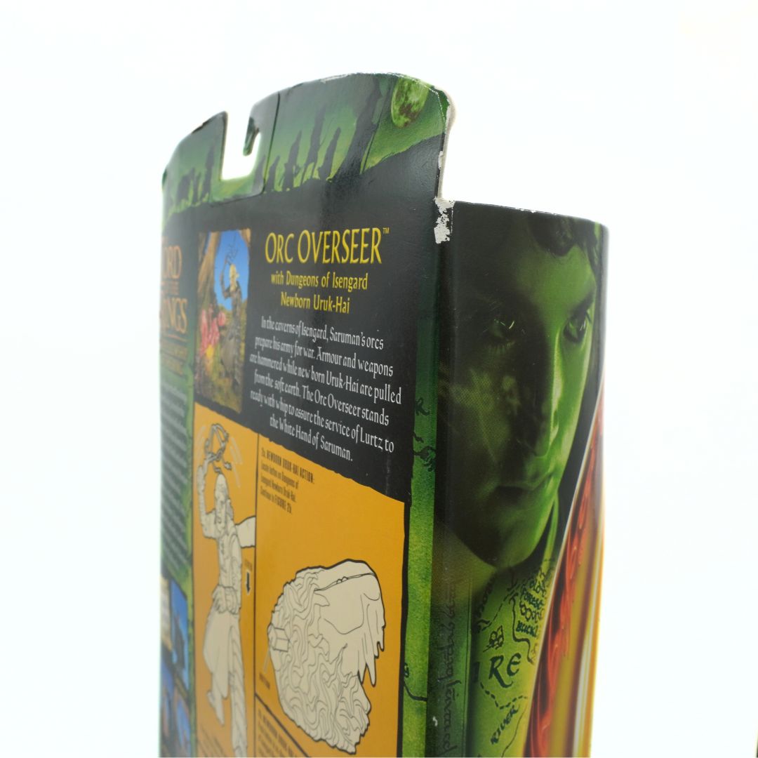 Toy figure packaging with green orc character on a white background