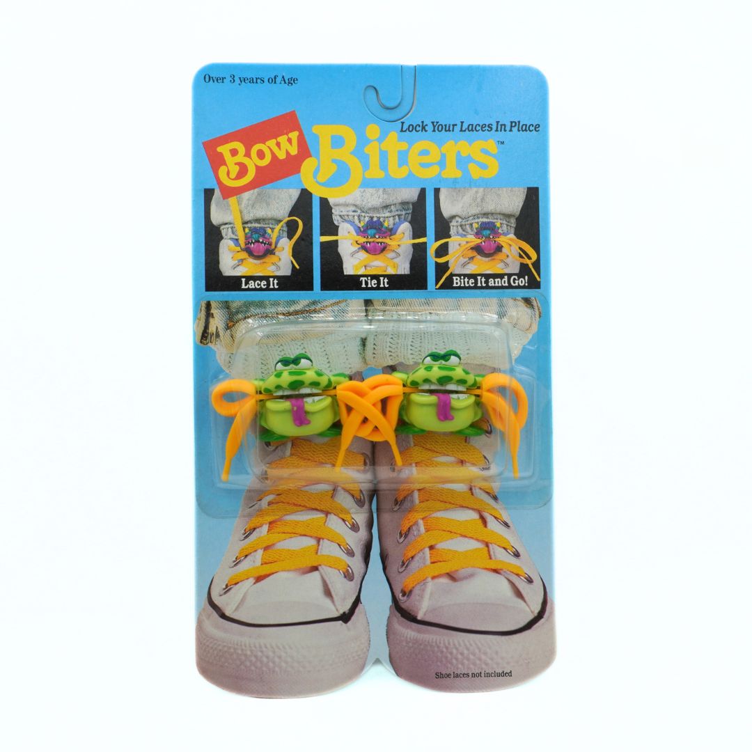 Packaged product of Bow Biters with yellow laces on a white background