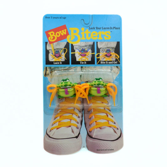 Packaged product of Bow Biters with yellow laces on a white background