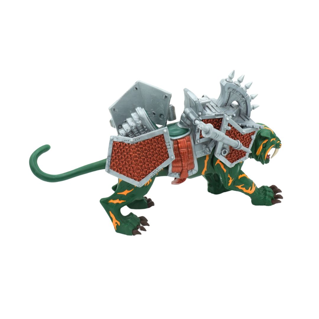 Toy figure of a green creature with armor on a white background