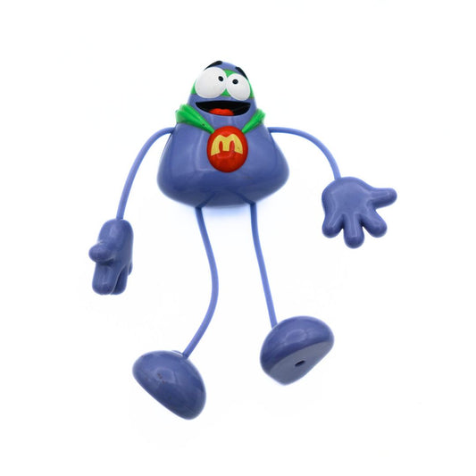 2004 McDonalds Happy Meal Grimace toy with long bendable legs with a green cape and mask