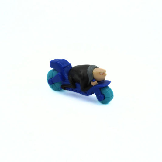 Toy figure of a character on a blue motorcycle with a white background