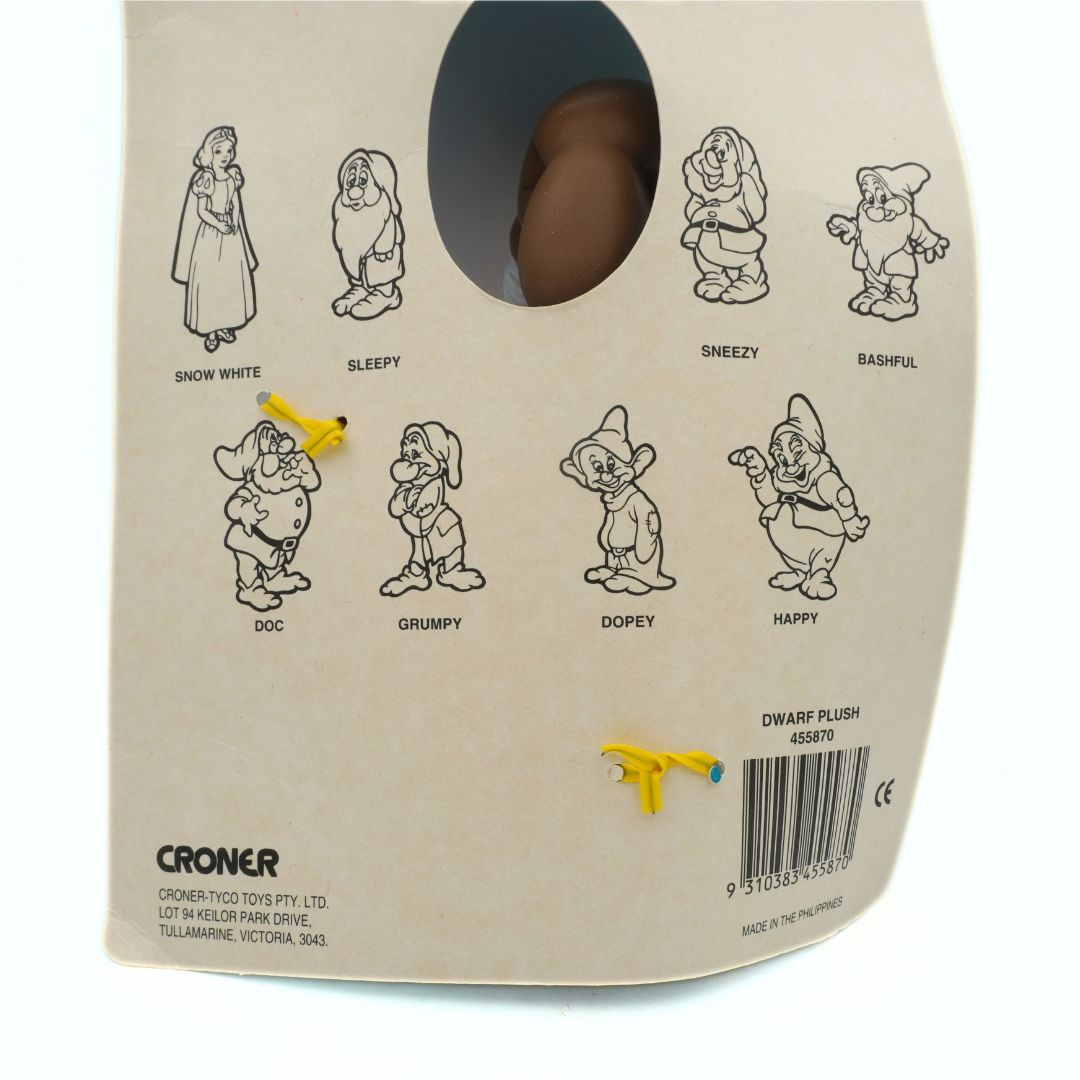 Back of a plush toy packaging with character illustrations and branding details.