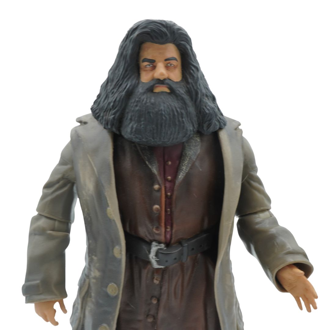 Action figure of a character with long hair and beard wearing a coat on a white background