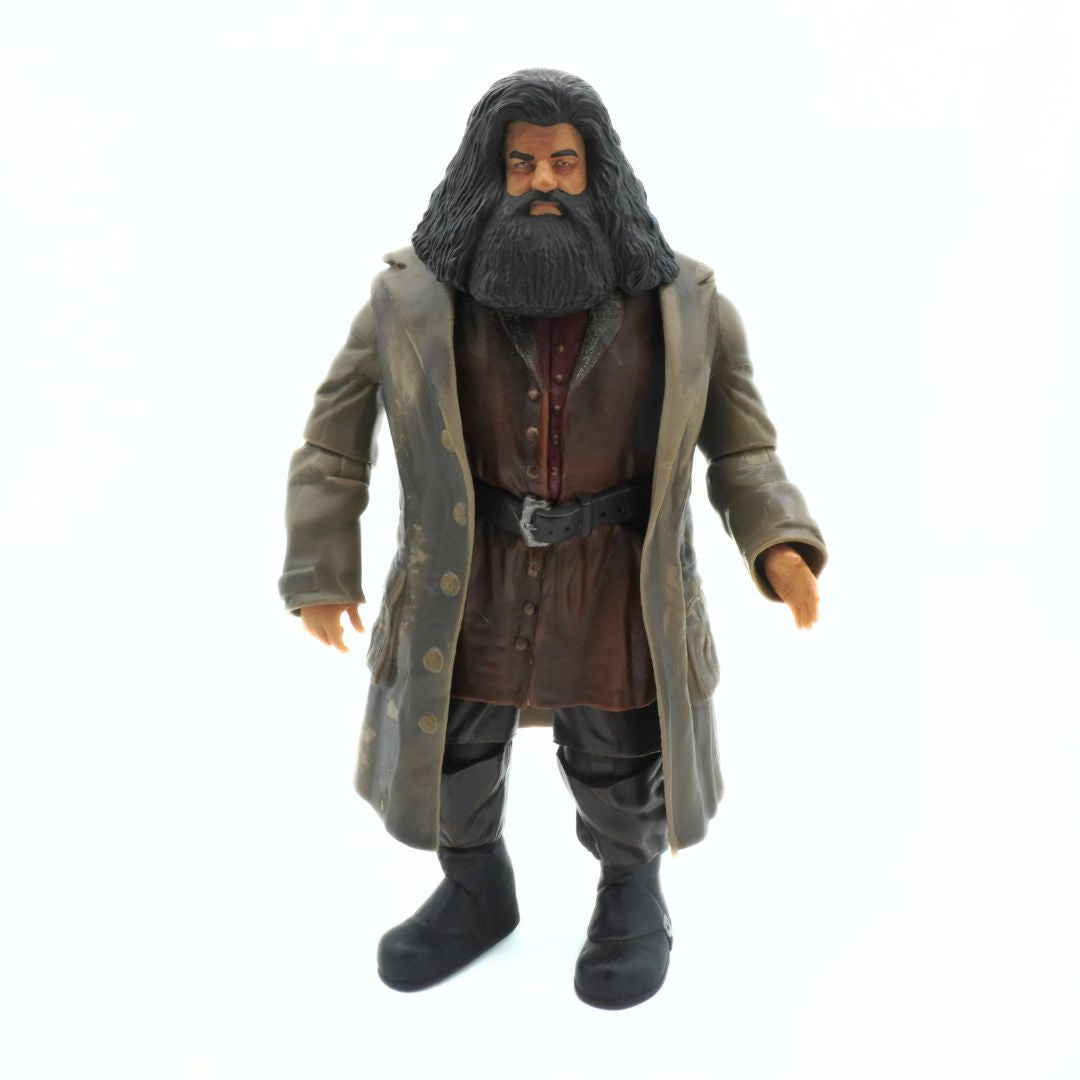 Action figure of a character with long hair and beard wearing a coat on a white background