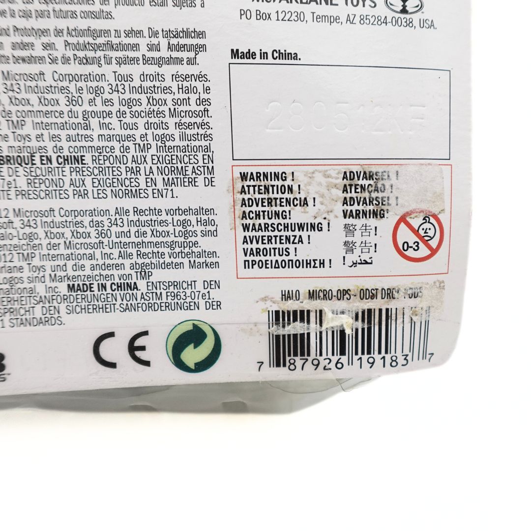 Close up of the barcode on the back of the 2012 Halo ODST Drop Pods packaging showing some damage and safety information