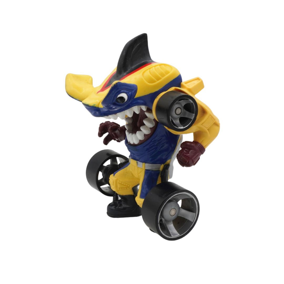 Toy figure of a shark with yellow and blue colors on a white background