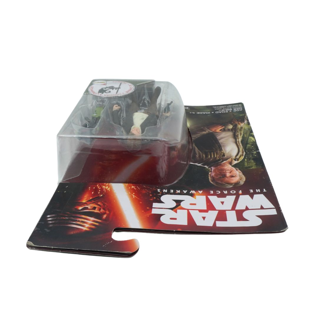 Star Wars toy figure in packaging on a promotional card with 'Star Wars' branding.