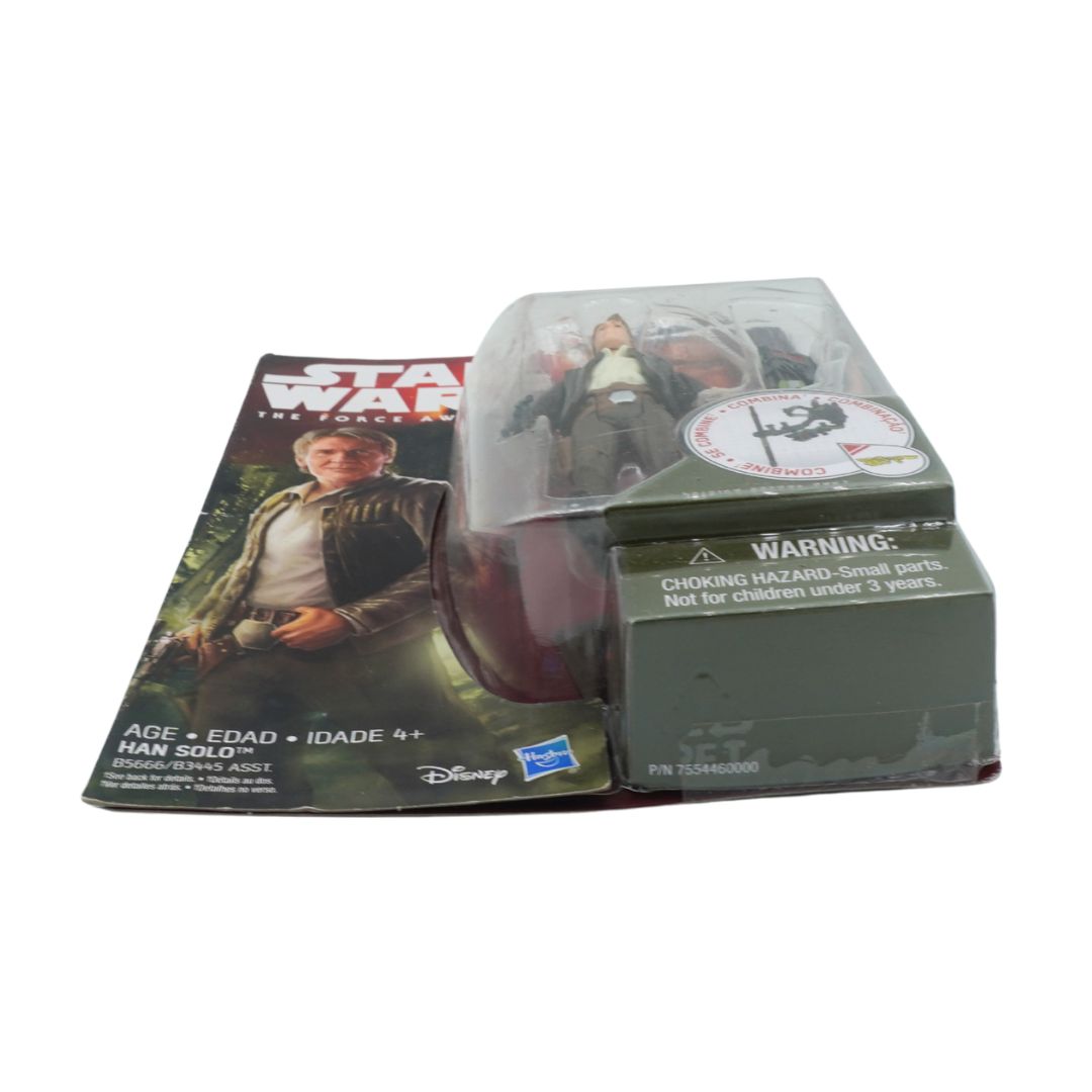 Star Wars toy figure in packaging with warning label on a white background