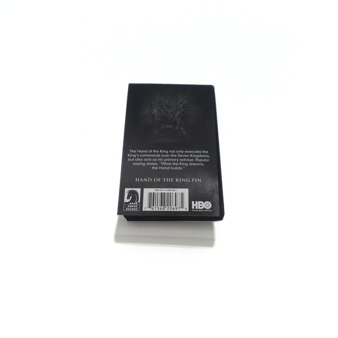 Packaging showing the back of the 2012 Hand of the King Dark Horse pin