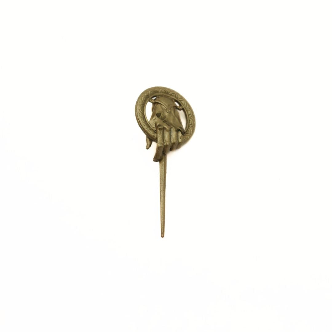 Front image of the gold toned metal Hand of the King pin from Game of Thrones