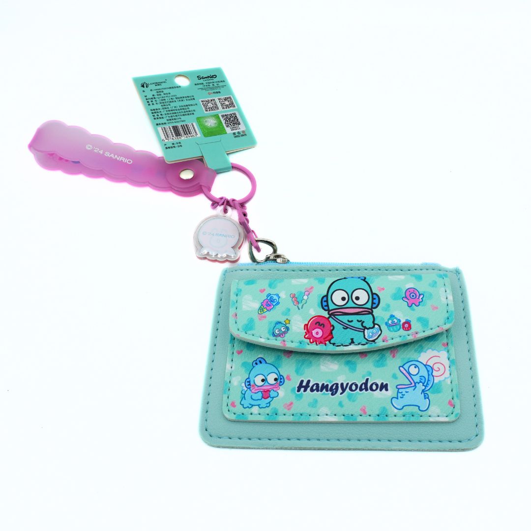 A Sanrio Hangyodon keychain wallet in light blue with a pink keychain and attached product tag, shown on a white background.