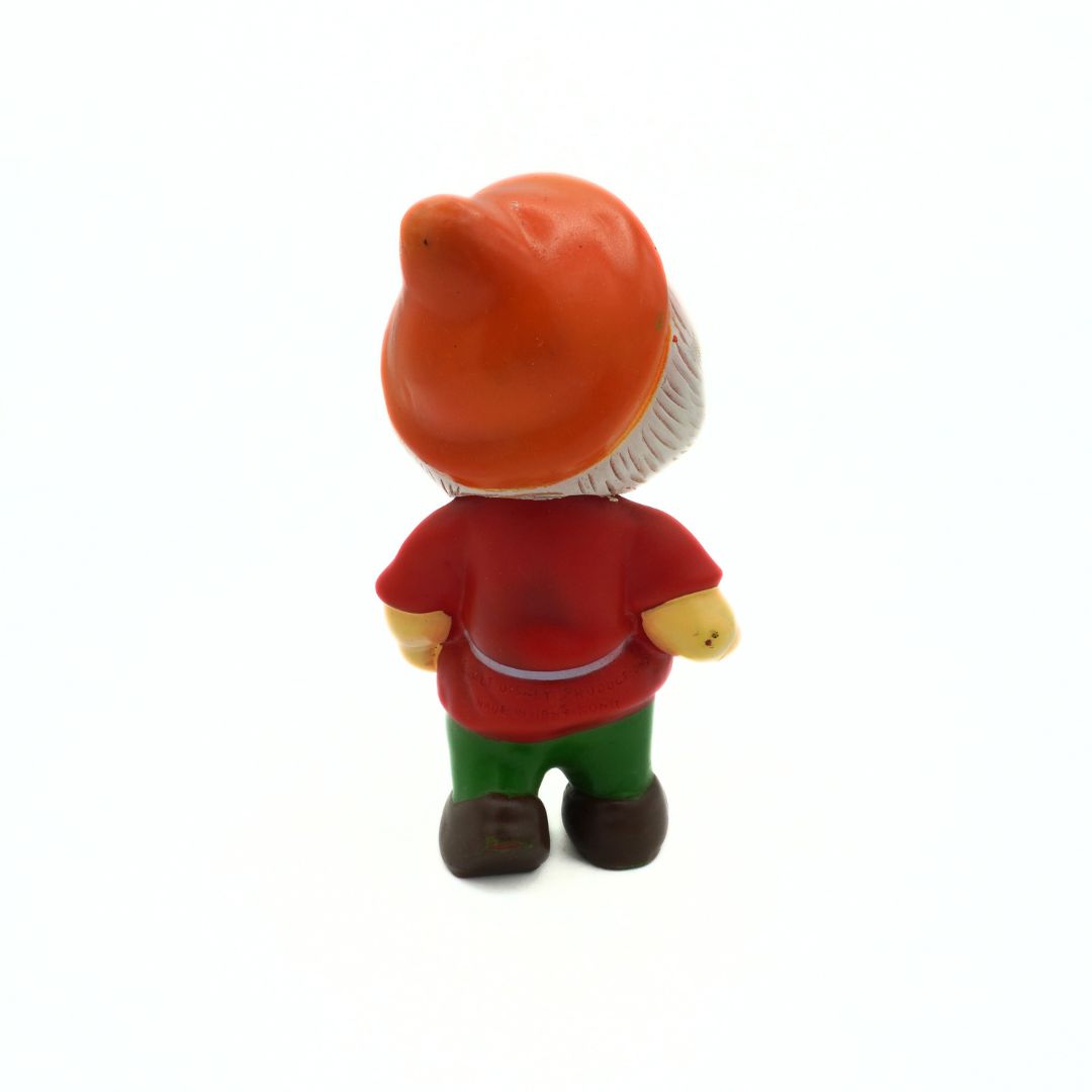 Toy figure with an orange hat and red shirt on a white background