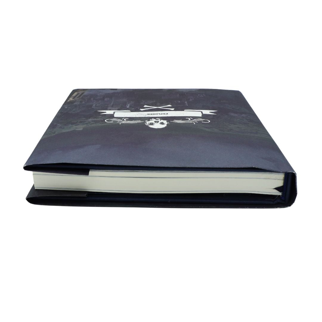 A hardcover notebook or journal with a dark navy blue cover featuring a white pirate skull and crossbones graphic, shown on a plain white background.