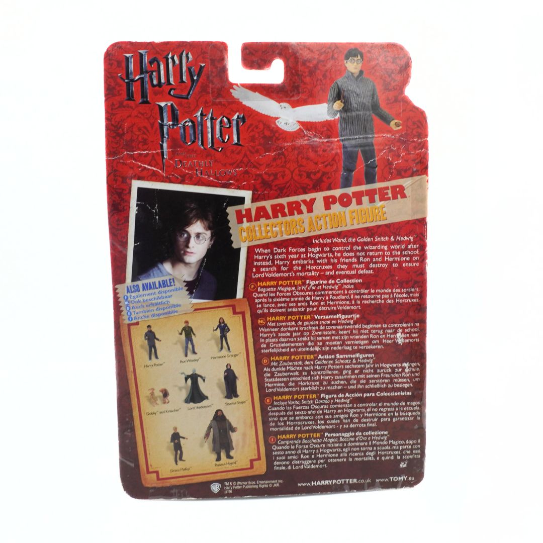 Harry Potter action figure packaging with character illustration and text on a red background