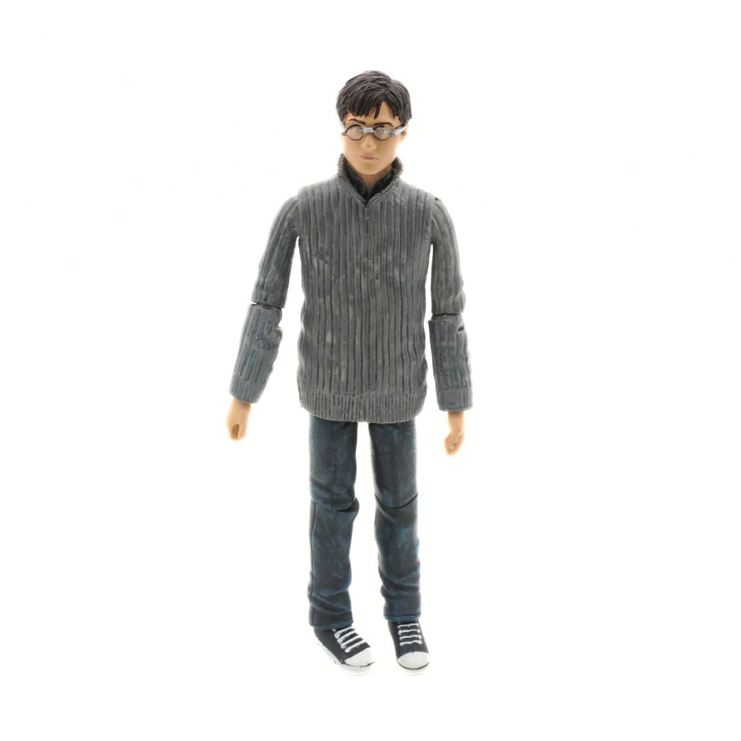 Action figure wearing a gray sweater and jeans on a white background