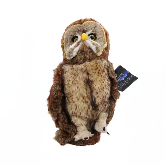 Plush owl toy with a tag on a white background