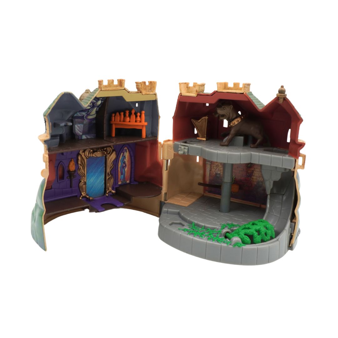 Toy castle set with detailed architecture and a lion figure on a white background