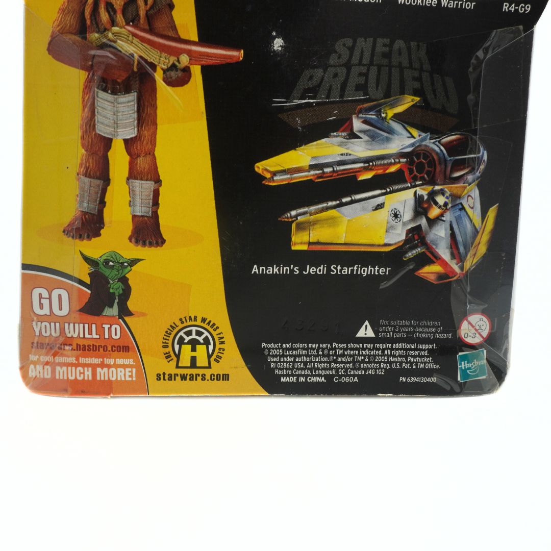 Toy figure packaging with a wookiee warrior and Anakin's Jedi Starfighter, featuring Hasbro branding.