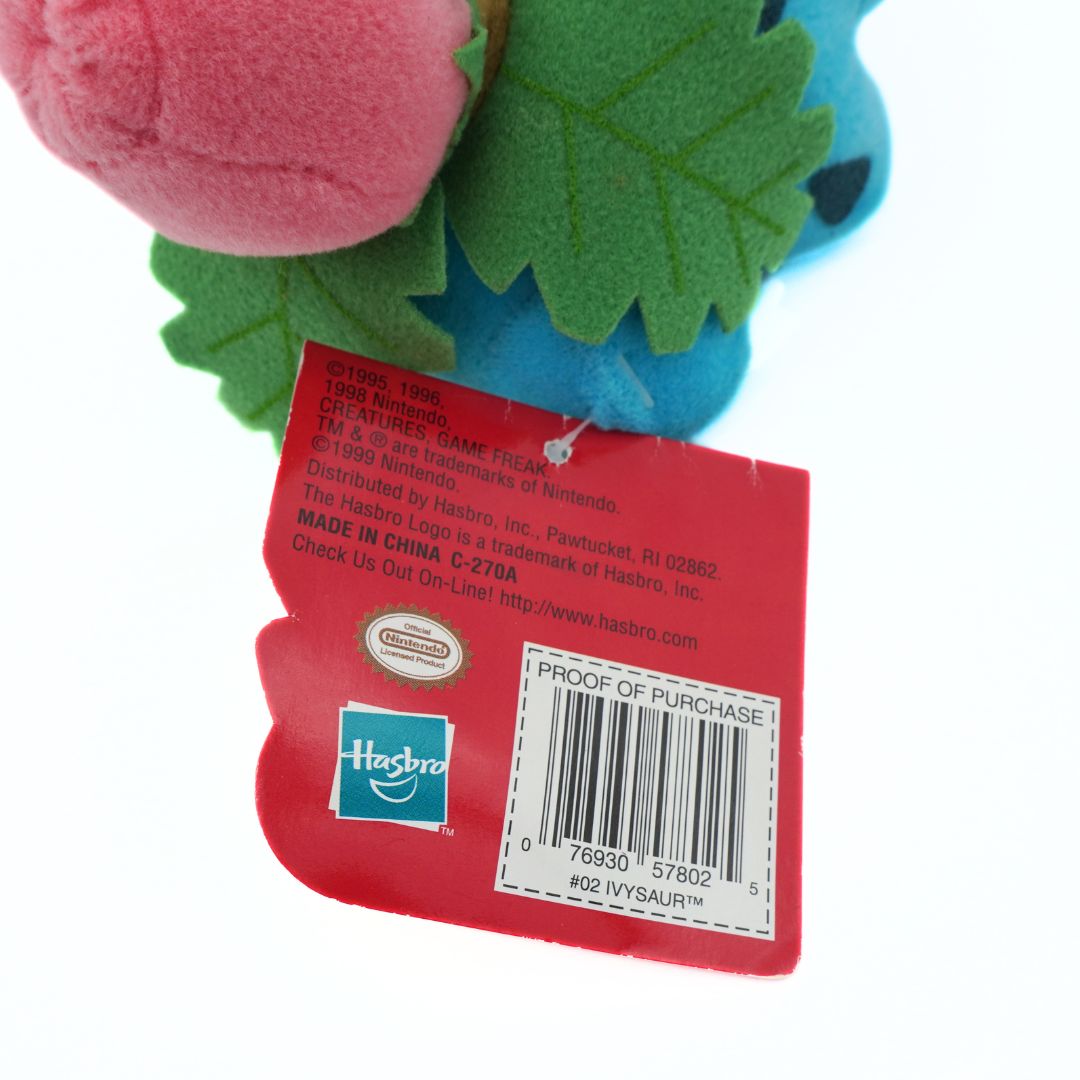 Toy with a red tag displaying a barcode and Hasbro logo on a white background