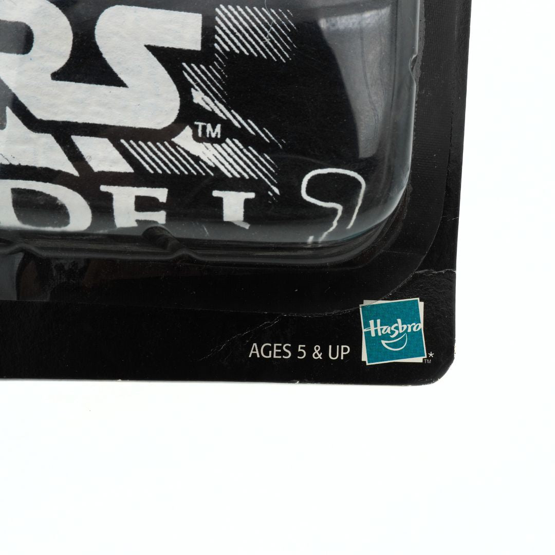 Close-up of a toy packaging with 'Hasbro' branding and age recommendation.