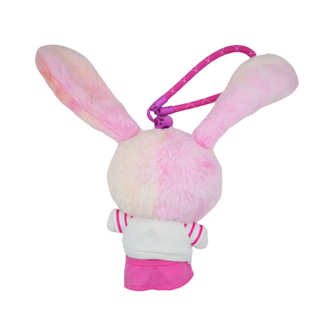 Photo of the back of a Hello Kitty plush dressed up as a pink bunny, with a pink and white outfit