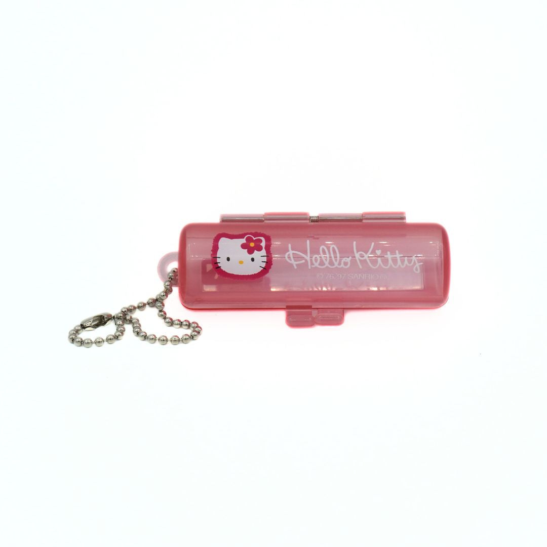 Pink Hello Kitty flashlight with chain on a white background