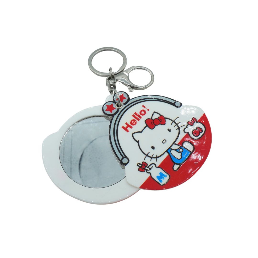 A red and white Hello Kitty keychain with a mirror inside, photographed against a white background