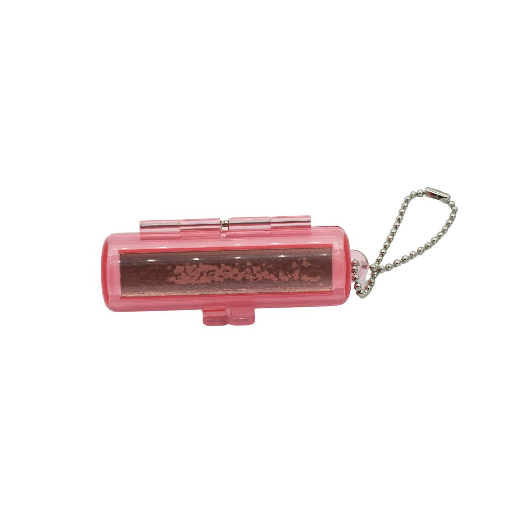 Pink lip balm holder with a keychain on a white background